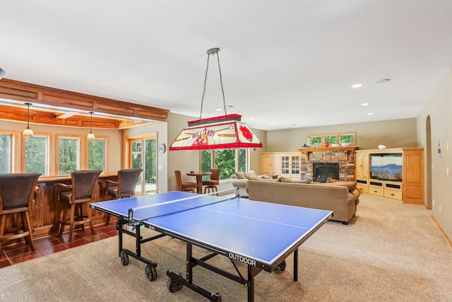 15758 Austin St NE, Ham Lake, MN 55304 - playroom featuring healthy amount of natural light, recessed lighting, a bar, a fireplace, and carpet