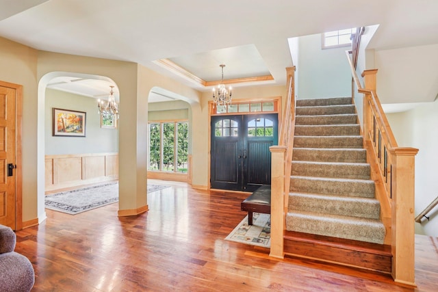 15758 Austin St NE, Ham Lake, MN 55304 - entryway with a chandelier, arched walkways, and wood finished floors