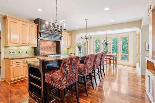 15758 Austin St NE, Ham Lake, MN 55304 - kitchen with a chandelier, light brown cabinets, recessed lighting, decorative backsplash, and light wood finished floors