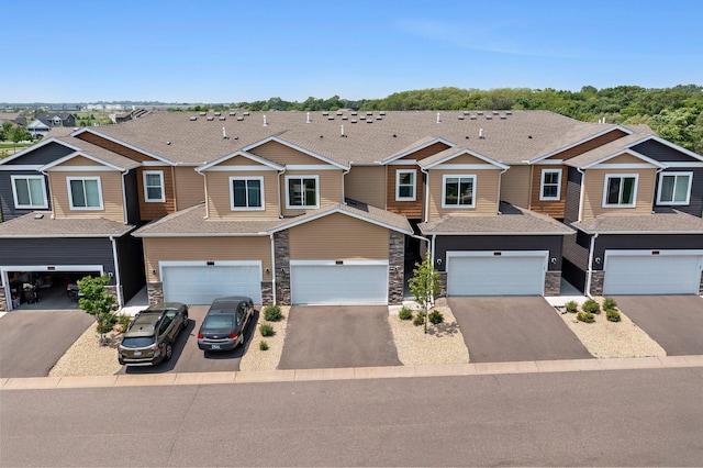 14834 Willemite Way NW, Ramsey, MN 55303 - multi unit property with a garage, driveway, stone siding, and a residential view