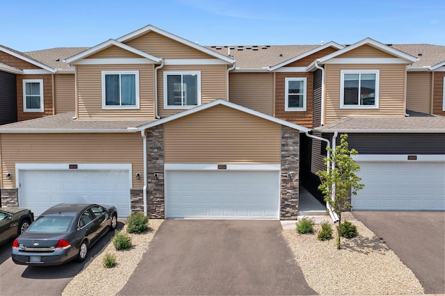 14834 Willemite Way NW, Ramsey, MN 55303 - multi unit property featuring driveway, stone siding, and a garage