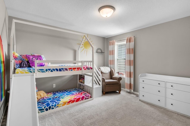 14834 Willemite Way NW, Ramsey, MN 55303 - bedroom featuring carpet flooring, a textured ceiling, and baseboards