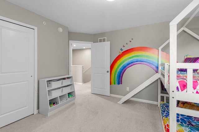 14834 Willemite Way NW, Ramsey, MN 55303 - unfurnished bedroom with carpet flooring, baseboards, and a textured ceiling