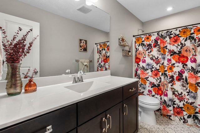 14834 Willemite Way NW, Ramsey, MN 55303 - bathroom featuring vanity, toilet, a shower with shower curtain, and recessed lighting