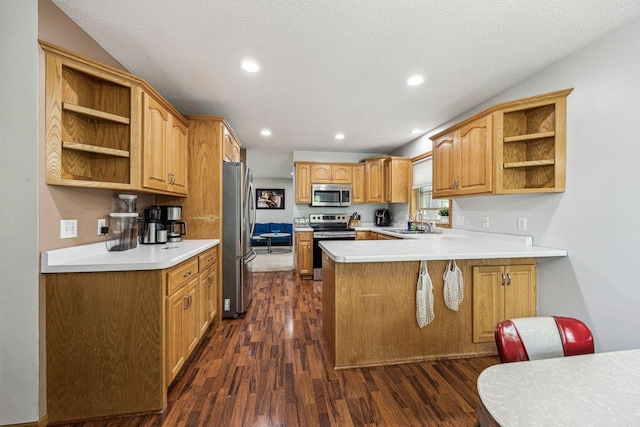 901 14th St N, Sartell, MN 56377 - kitchen with appliances with stainless steel finishes, open shelves, dark wood-style flooring, a peninsula, and light countertops