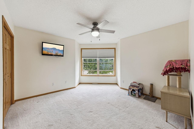 901 14th St N, Sartell, MN 56377 - unfurnished bedroom featuring carpet flooring, a textured ceiling, and ceiling fan