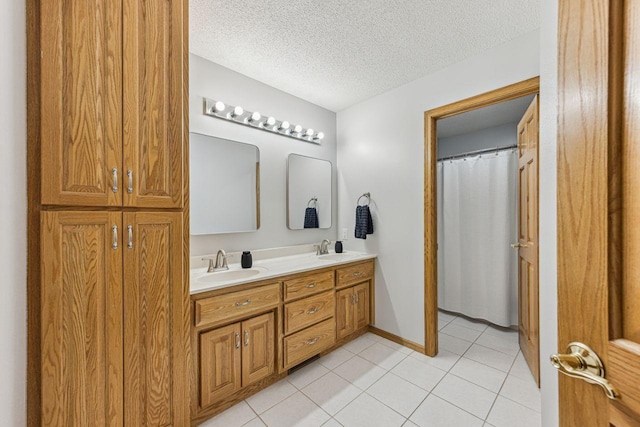 901 14th St N, Sartell, MN 56377 - full bathroom featuring double vanity, tile patterned floors, and a textured ceiling