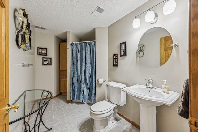 901 14th St N, Sartell, MN 56377 - bathroom with a textured ceiling and curtained shower