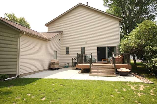 901 14th St N, Sartell, MN 56377 - back of property with a patio, a yard, and a wooden deck