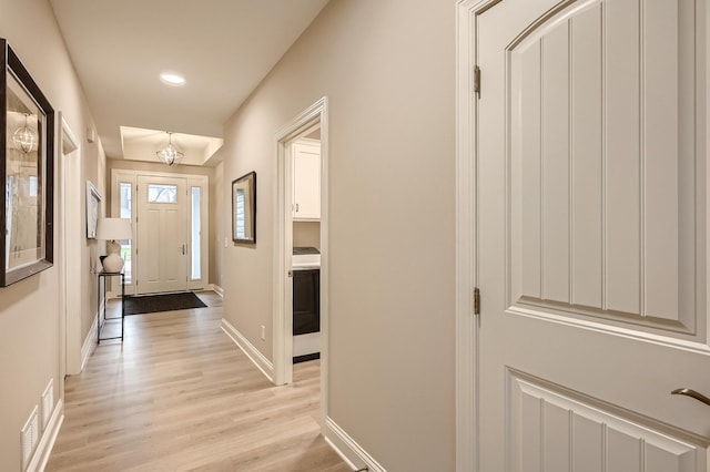 5054 Dale Ridge Rd, Woodbury, MN 55129 - entryway with light wood-style floors, washer / clothes dryer, recessed lighting, and baseboards