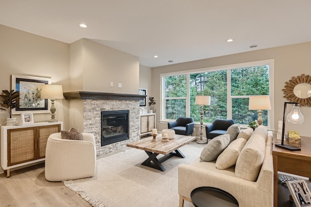 5054 Dale Ridge Rd, Woodbury, MN 55129 - living area featuring wood finished floors, a stone fireplace, and recessed lighting
