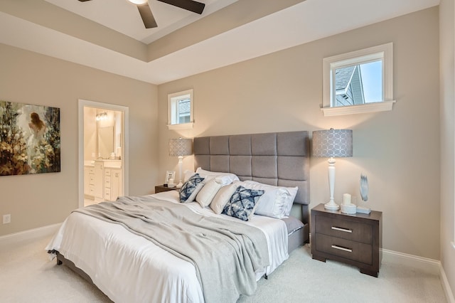 5054 Dale Ridge Rd, Woodbury, MN 55129 - carpeted bedroom with baseboards, ensuite bathroom, and a ceiling fan