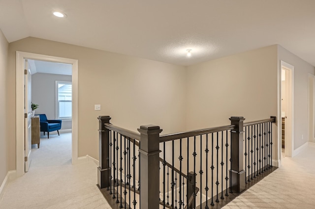 5054 Dale Ridge Rd, Woodbury, MN 55129 - hall with an upstairs landing, carpet, baseboards, recessed lighting, and vaulted ceiling