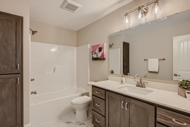 5054 Dale Ridge Rd, Woodbury, MN 55129 - bathroom featuring marble finish floors, vanity, toilet, shower / washtub combination, and a textured ceiling