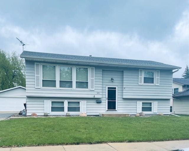 601 17 1/2 St SE, Rochester, MN 55904 - raised ranch with a front yard, an outbuilding, and a garage