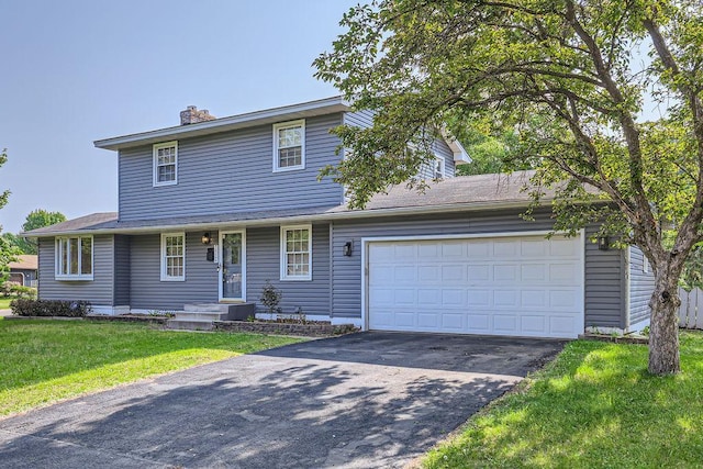 7724 Major Ave N, Brooklyn Park, MN 55443 - traditional-style house with asphalt driveway, a front lawn, a garage, and a chimney