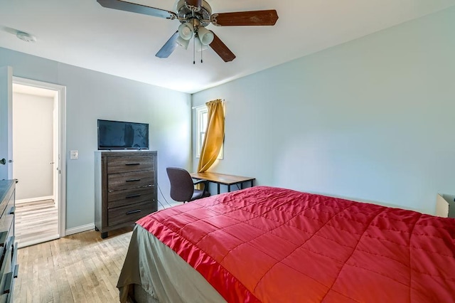 7724 Major Ave N, Brooklyn Park, MN 55443 - bedroom with light wood-type flooring, baseboards, and ceiling fan