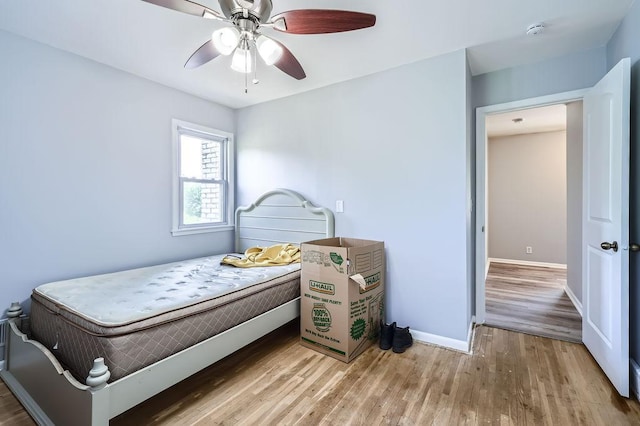 7724 Major Ave N, Brooklyn Park, MN 55443 - bedroom featuring wood finished floors, baseboards, and ceiling fan