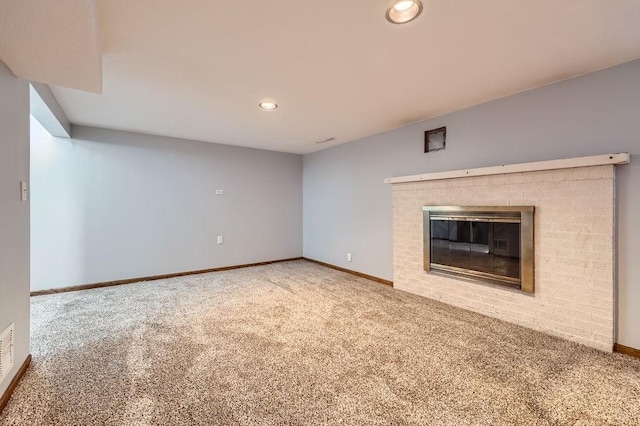 7724 Major Ave N, Brooklyn Park, MN 55443 - unfurnished living room with carpet, a brick fireplace, baseboards, and recessed lighting