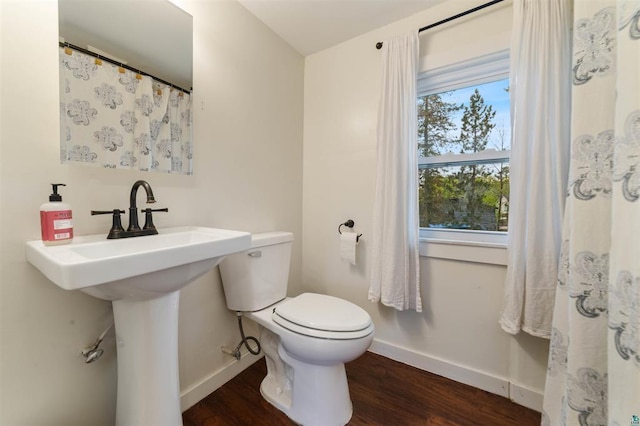 2508 Springvale Rd, Duluth, MN 55811 - bathroom featuring baseboards, toilet, and wood finished floors