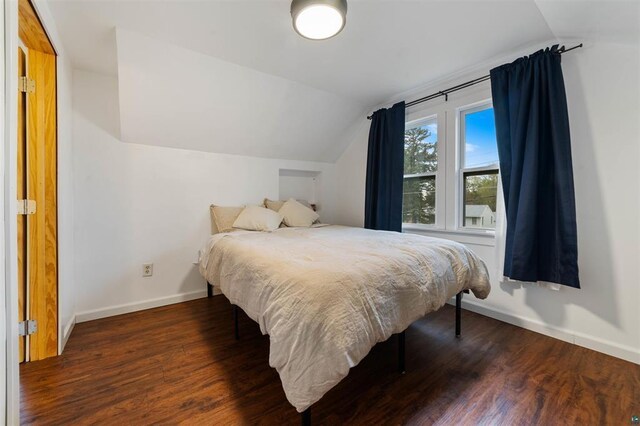 2508 Springvale Rd, Duluth, MN 55811 - bedroom with vaulted ceiling, baseboards, and wood finished floors