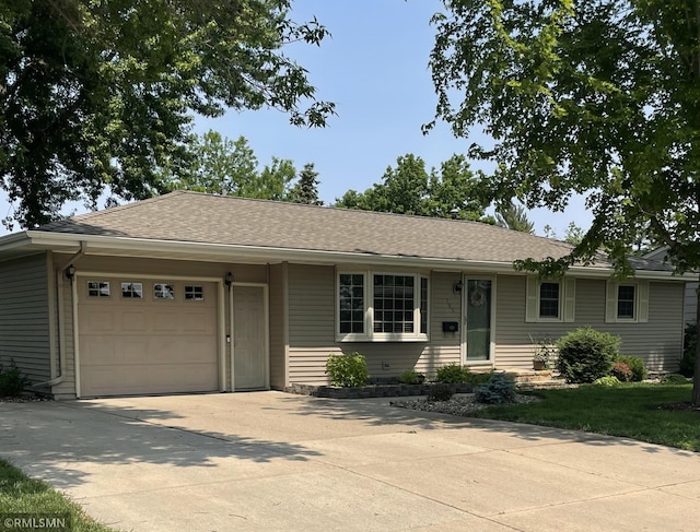 705 Turril St, Le Sueur, MN 56058 - single story home featuring an attached garage, driveway, and roof with shingles