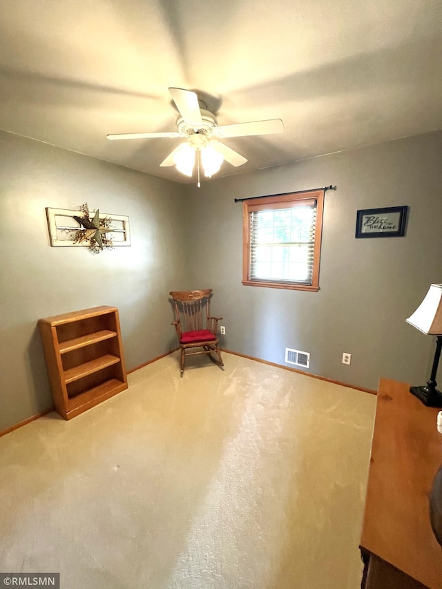 705 Turril St, Le Sueur, MN 56058 - living area with ceiling fan, baseboards, and carpet
