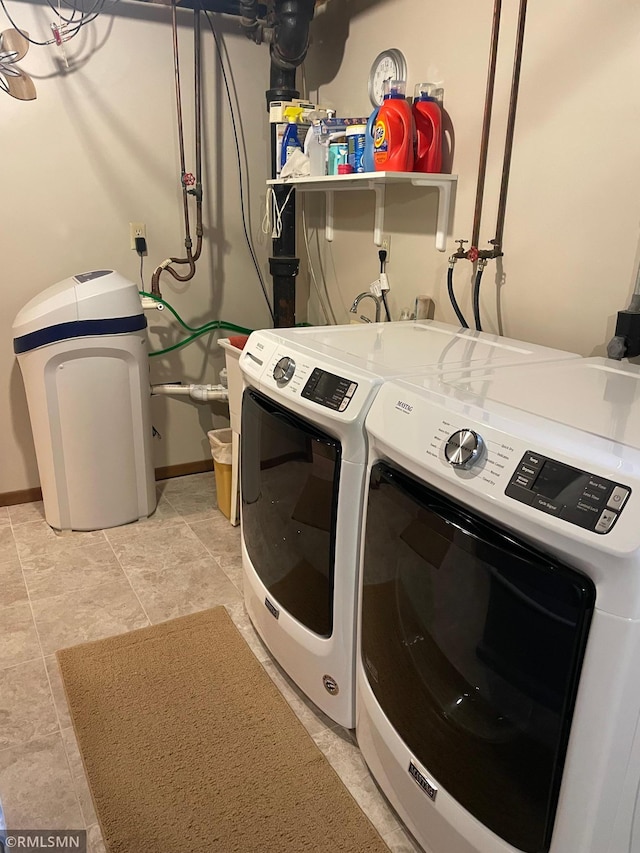 705 Turril St, Le Sueur, MN 56058 - laundry area with washing machine and clothes dryer and baseboards