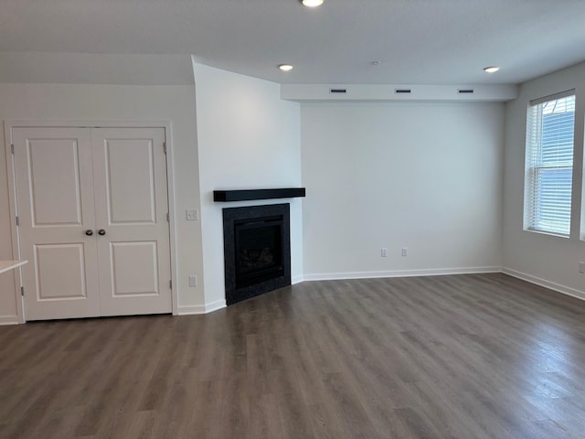 1727 Hauer Trl, Shakopee, MN 55379 - unfurnished living room featuring dark wood finished floors, a fireplace, and recessed lighting