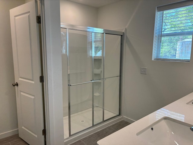 1727 Hauer Trl, Shakopee, MN 55379 - full bath with a stall shower, wood finished floors, and double vanity
