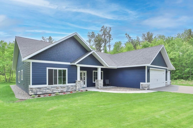 16460 Sanctuary Way, Brainerd, MN 56401 - craftsman-style house featuring a front yard, stone siding, concrete driveway, roof with shingles, and covered porch