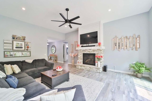 16460 Sanctuary Way, Brainerd, MN 56401 - living area with wood finished floors, ceiling fan, a stone fireplace, baseboards, and recessed lighting