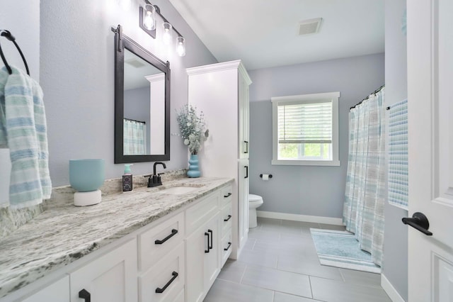 16460 Sanctuary Way, Brainerd, MN 56401 - full bath with toilet, vanity, baseboards, and tile patterned floors