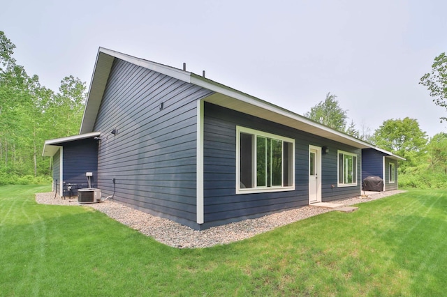16460 Sanctuary Way, Brainerd, MN 56401 - rear view of property with a yard and central air condition unit