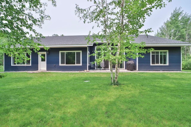 16460 Sanctuary Way, Brainerd, MN 56401 - rear view of house with a yard and roof with shingles