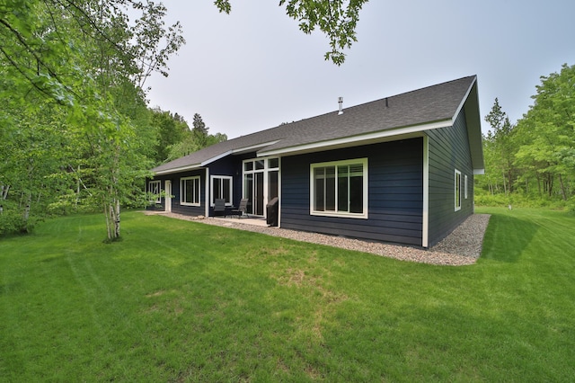 16460 Sanctuary Way, Brainerd, MN 56401 - rear view of house featuring a lawn and a shingled roof