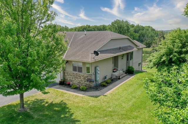 735 Highview Ct, Saint Croix Falls, WI 54024 - view of front of house featuring a front yard and a shingled roof