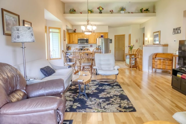 735 Highview Ct, Saint Croix Falls, WI 54024 - living area featuring light wood-style floors and a chandelier