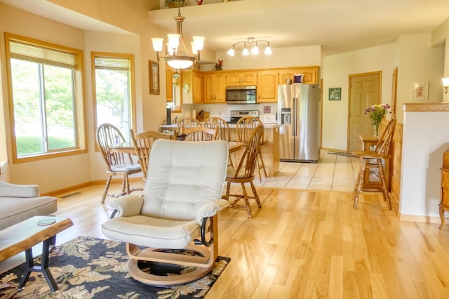 735 Highview Ct, Saint Croix Falls, WI 54024 - dining space with light wood-style flooring and baseboards