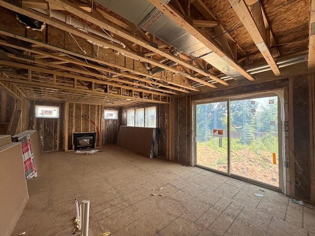 6135 Harkness Ln S, Cottage Grove, MN 55016 - misc room with a wood stove