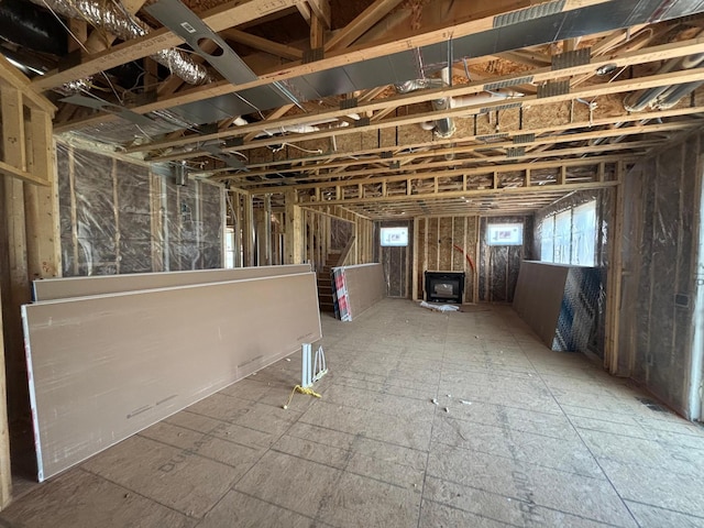 6135 Harkness Ln S, Cottage Grove, MN 55016 - basement featuring a wood stove