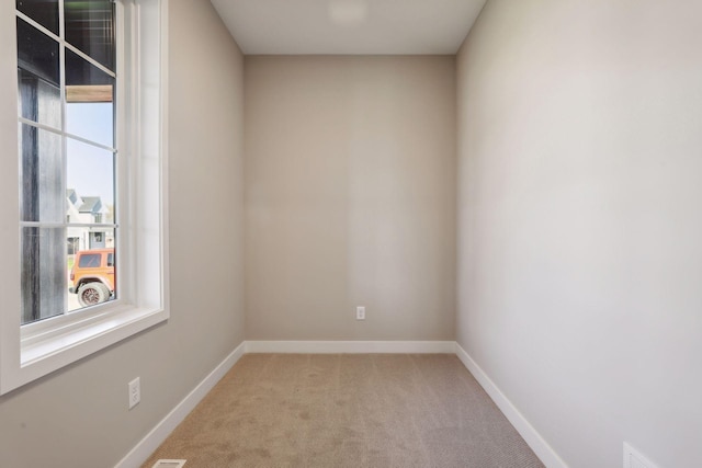 6135 Harkness Ln S, Cottage Grove, MN 55016 - empty room featuring light carpet and baseboards