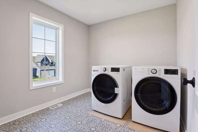6135 Harkness Ln S, Cottage Grove, MN 55016 - laundry area featuring washer and dryer and baseboards