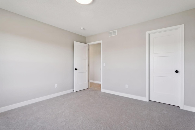 6135 Harkness Ln S, Cottage Grove, MN 55016 - unfurnished bedroom with carpet flooring and baseboards
