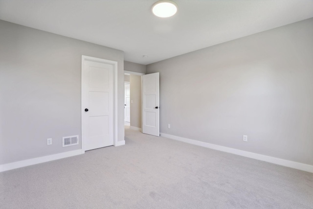 6135 Harkness Ln S, Cottage Grove, MN 55016 - unfurnished bedroom featuring light carpet and baseboards