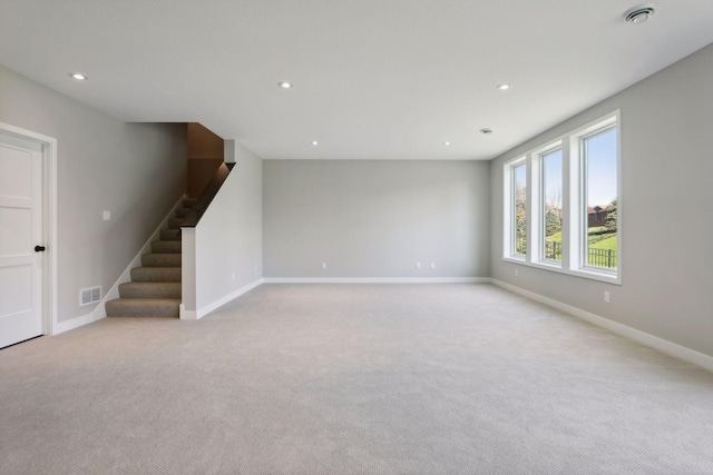 6135 Harkness Ln S, Cottage Grove, MN 55016 - unfurnished room with light colored carpet, stairs, and recessed lighting