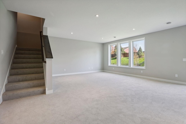 6135 Harkness Ln S, Cottage Grove, MN 55016 - unfurnished living room with stairs, light carpet, and recessed lighting