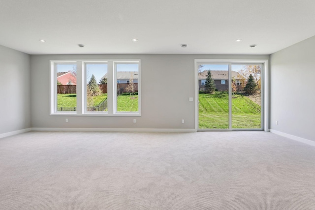 6135 Harkness Ln S, Cottage Grove, MN 55016 - carpeted empty room with plenty of natural light and recessed lighting