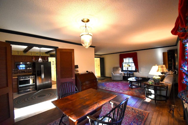 2645 Riverside Ln NE, Rochester, MN 55906 - dining area featuring hardwood / wood-style flooring, crown molding, and a textured ceiling