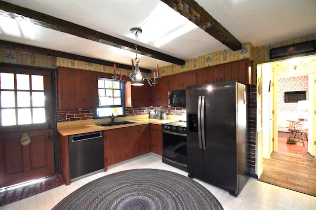 2645 Riverside Ln NE, Rochester, MN 55906 - kitchen with black appliances, beam ceiling, light countertops, wallpapered walls, and a sink